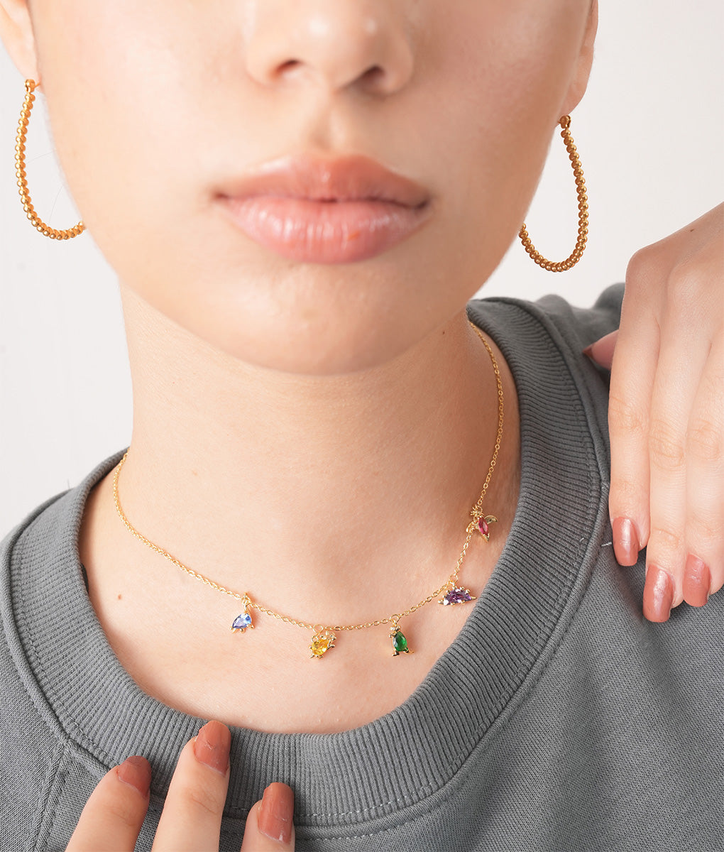 gold-plated chain and delightful dangling charms.