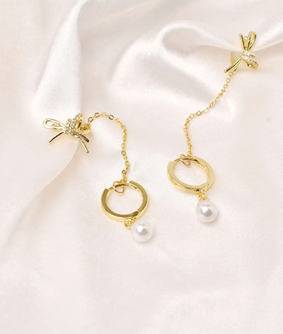 pearl and bow cuff earrings