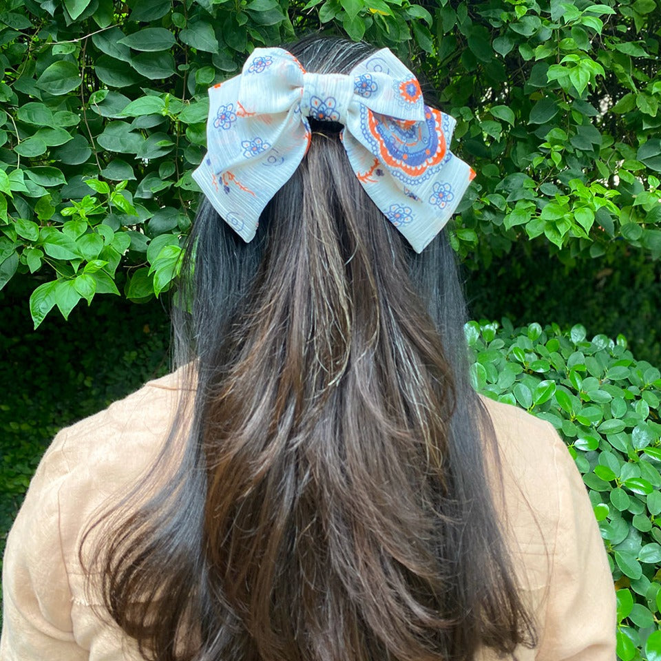 white bow with multi print 